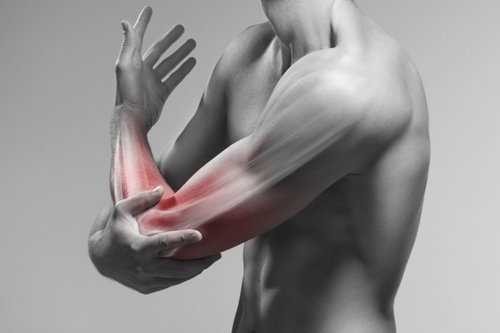 Man experiencing painful tennis elbow in Prescott, AZ