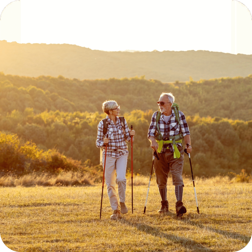 elderly man and woman hiking in nature